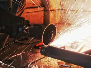 Grinding a steel pipe