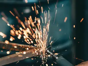 Grinder throwing sparks off a steel edge