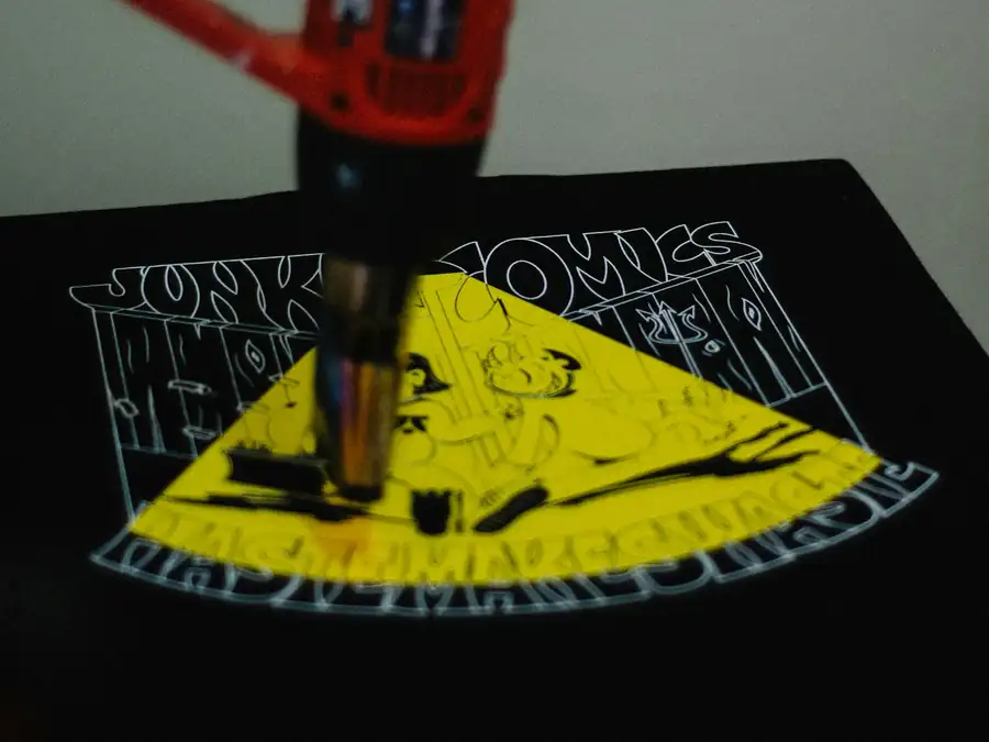 Heat gun held in a gloved hand