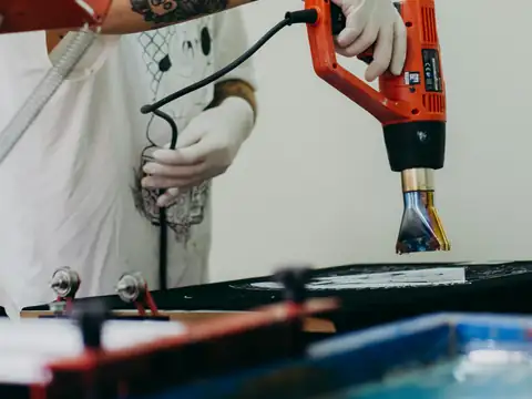 Heat gun being used on a workbench