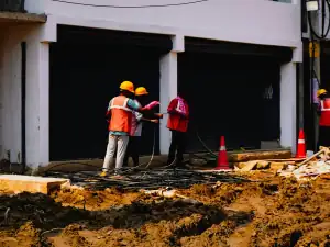 Site crew in helmets and high-visibility vests