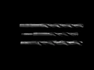 Twist drill bits on a dark background